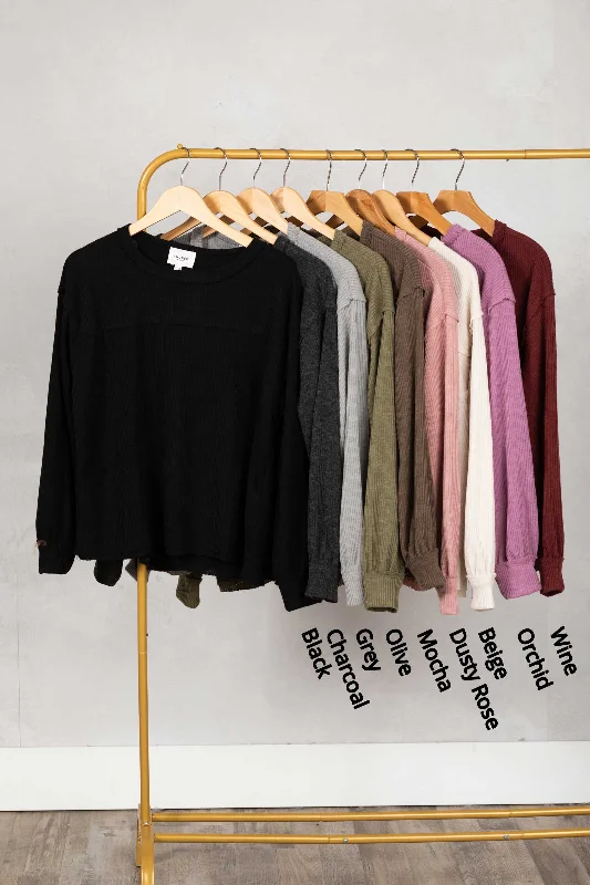 Shop and Save Solid Knit Top With Asymmetrical Exposed Seams